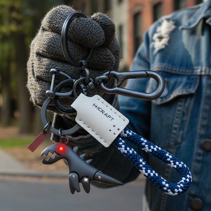 Breloque dinosaure en alliage d'aluminium associée à un bracelet tissé à la main
