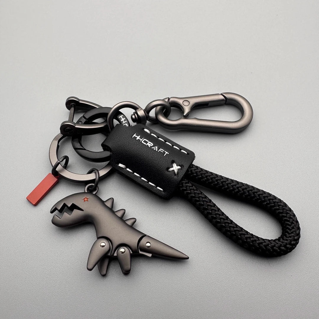 Breloque dinosaure en alliage d'aluminium associée à un bracelet tissé à la main